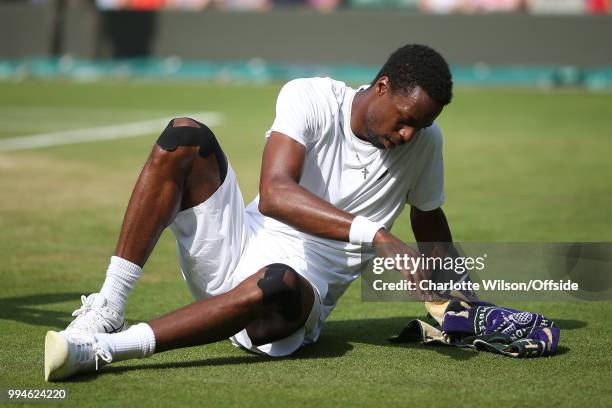 Mens Singles - Gael Monfils v Kevin Anderson - Gael Monfils gets up after falling for a third time at All England Lawn Tennis and Croquet Club on...