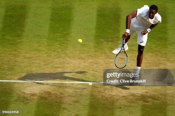 Gael Monfils of France serves against Kevin Anderson of South Africa during their Men's Singles fourth round match on day seven of the Wimbledon Lawn...