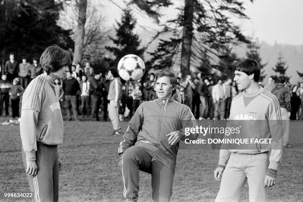 Photo taken on February 21, 1982 shows French coach of the national team Michel Hidalgo , flanked by defensive midfielder Daniel Bravo and defender...