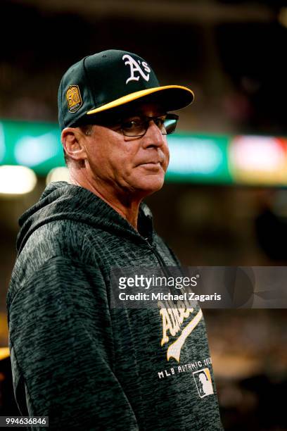 Manager Bob Melvin of the Oakland Athletics stands in the dugout during the game against the Houston Astros at the Oakland Alameda Coliseum on June...