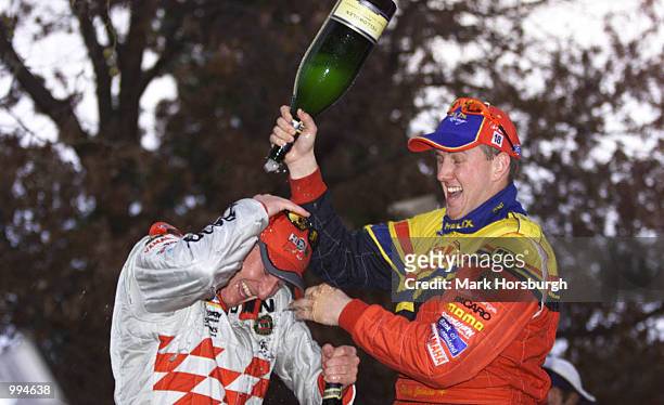 Ford driver Steve Johnson celebrates with Holden driver Mark Skaife after winning the GMC 400 today in Canberra . Australia . DIGITAL IMAGE X...