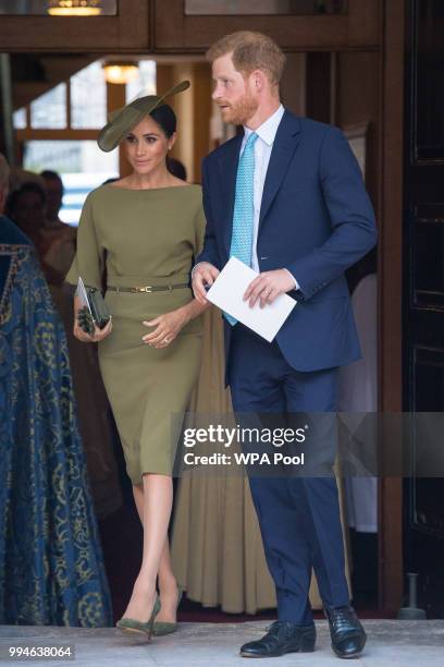 The Duke and Duchess of Sussex depart after attending the christening of Prince Louis at the Chapel Royal, St James's Palace on July 09, 2018 in...