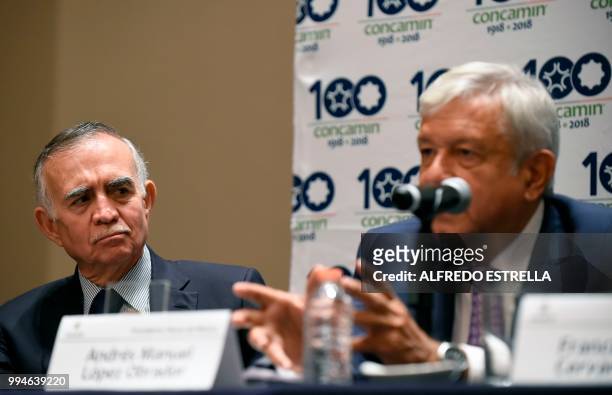 Mexico's President-elect Andres Manuel Lopez Obrador speaks during a press conference next to his Presidency's coordinator, Alfonso Romo , after a...