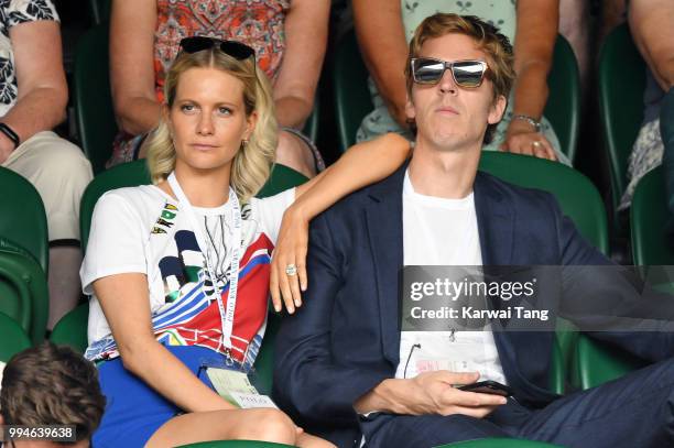 Poppy Delevingne and her husband James Cook attend day seven of the Wimbledon Tennis Championships at the All England Lawn Tennis and Croquet Club on...