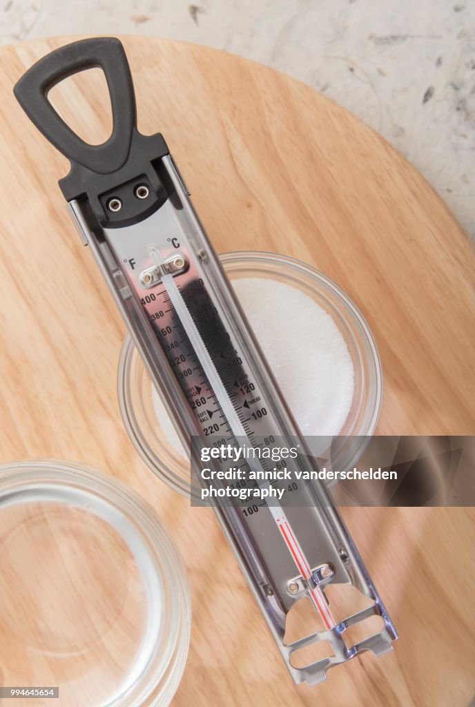 Sugar thermometer, granulated sugar and water