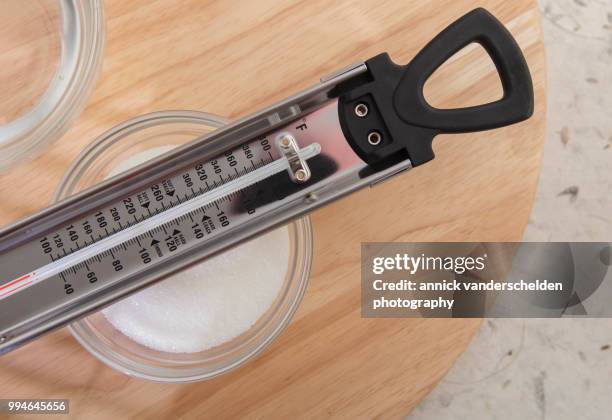 sugar thermometer, granulated sugar and water - granulated sugar stock pictures, royalty-free photos & images