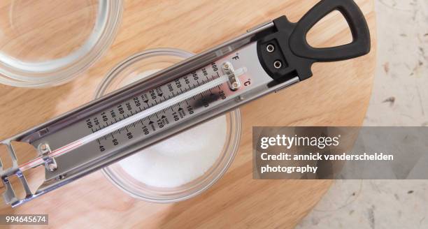 sugar thermometer, granulated sugar and water - granulated sugar stock pictures, royalty-free photos & images