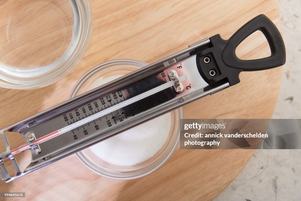 Sugar thermometer, granulated sugar and water