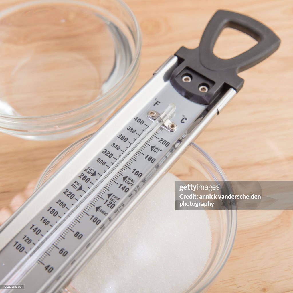 Sugar thermometer, granulated sugar and water