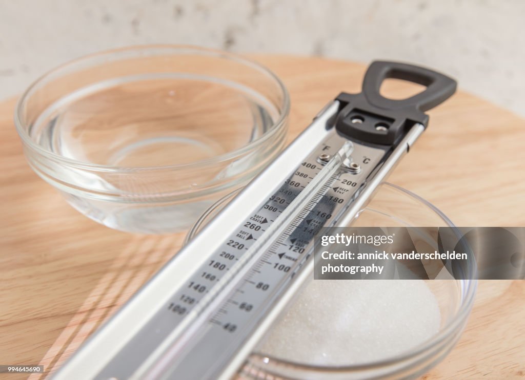 Sugar thermometer, granulated sugar and water
