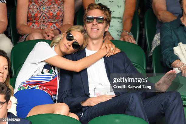 Poppy Delevingne and her husband James Cook attend day seven of the Wimbledon Tennis Championships at the All England Lawn Tennis and Croquet Club on...