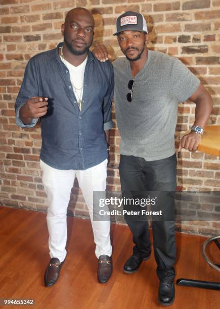 Omar J. Dorsey and Anthony Mackie both pose for photos during the Starz Power Brunch at Cochon on July 8, 2018 in New Orleans, Louisiana.