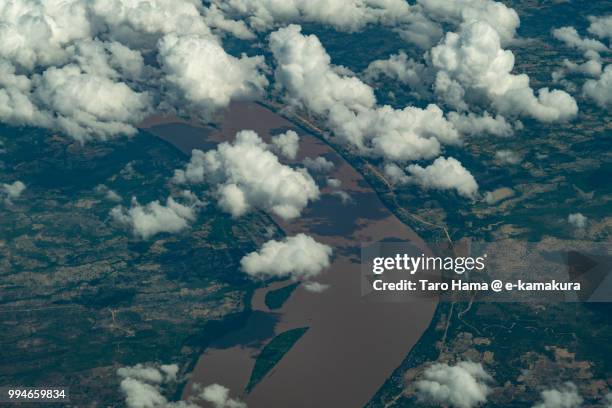clouds on mekong river in champasak province in laos daytime aerial view from airplane - champasak stock pictures, royalty-free photos & images