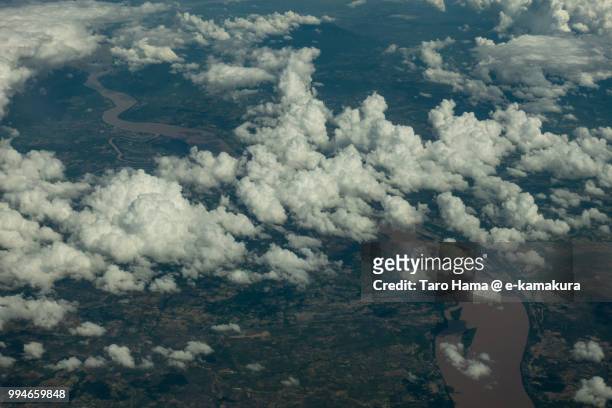 clouds on mekong river in champasak province in laos daytime aerial view from airplane - champasak stock pictures, royalty-free photos & images