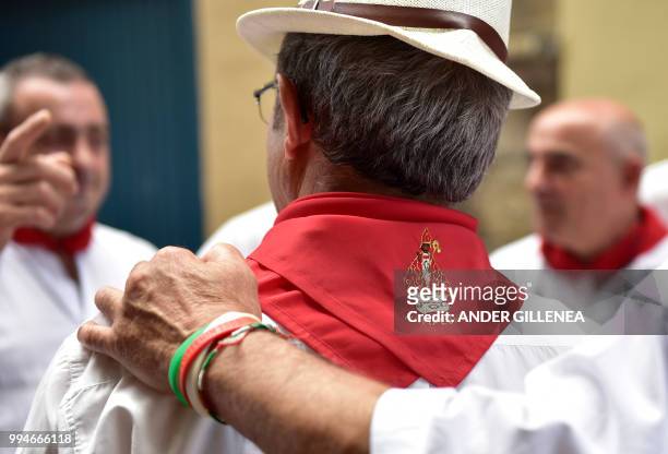 Revelers takes part in the San Fermin bull run festival in Pamplona, northern Spain on July 9, 2018 - Each day at 8am hundreds of people race with...