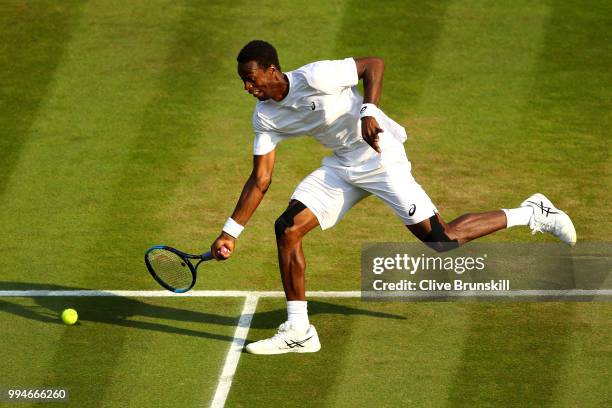 Gael Monfils of France plays a forehand against Kevin Anderson of South Africa during their Men's Singles fourth round match on day seven of the...