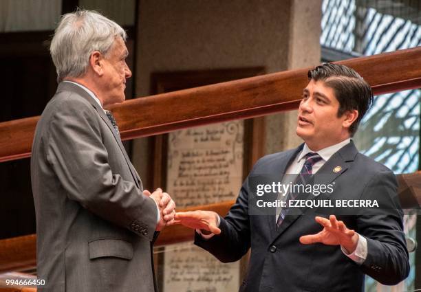 Chilean President Sebastian Pinera speaks with Costa Rican President Carlos Alvarado at the presidential house in San Jose, July 9, 2018. - Pinera is...