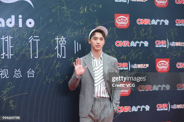 Singer and actor Xu Weizhou arrives at the red carpet of the Music Radio China Top Chart Awards Ceremony on July 6, 2018 in Beijing, China.