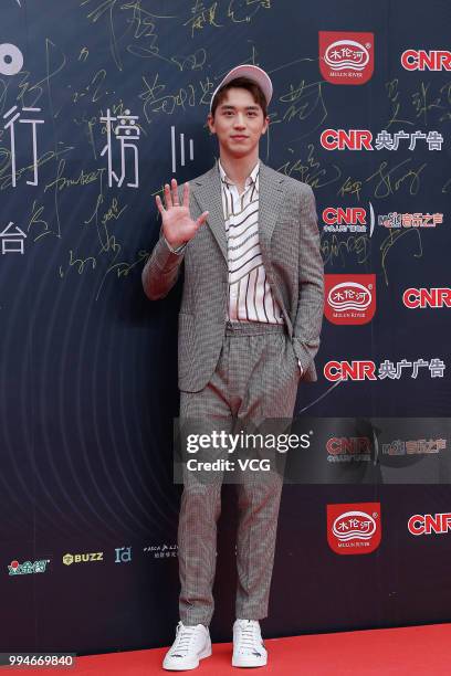 Singer and actor Xu Weizhou arrives at the red carpet of the Music Radio China Top Chart Awards Ceremony on July 6, 2018 in Beijing, China.