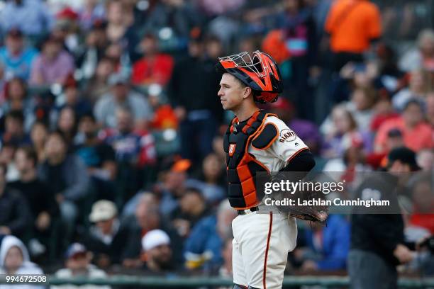 Catcher Buster Posey of the San Francisco Giants looks on during the first inning of the game against the St Louis Cardinals at AT&T Park on July 5,...