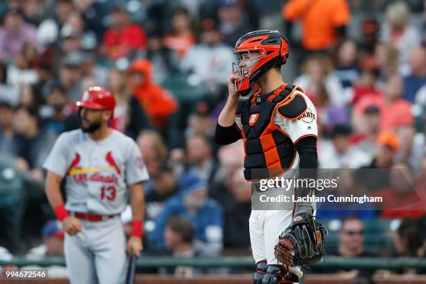 Catcher Buster Posey of the San Francisco Giants looks on during the first inning of the game against the St Louis Cardinals at AT&T Park on July 5,...