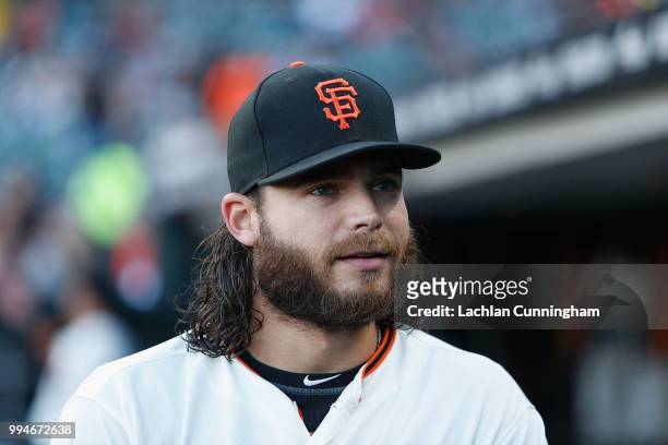 Brandon Crawford of the San Francisco Giants looks on from the dugout before the game against the St Louis Cardinals at AT&T Park on July 5, 2018 in...