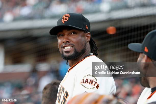 Alen Hanson of the San Francisco Giants looks on from the dugout before the game against the St Louis Cardinals at AT&T Park on July 5, 2018 in San...