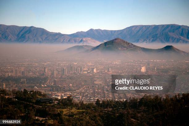 View of smog over Santiago, on July 9, 2018. - Chilean authorities declared a new environmental preemergency Monday, as high levels of air pollution...