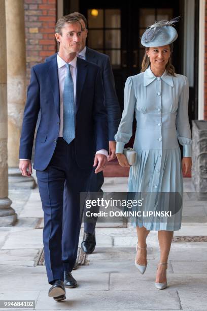 Pippa Middleton, sibling of Britain's Catherine, Duchess of Cambridge, arrives with her husband James Matthews for the christening of Britain's...