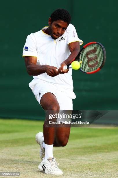 Joao Lucas Reis Da Silva of Brazil plays a backhand in his Boys' Singles first round match on day seven of the Wimbledon Lawn Tennis Championships at...