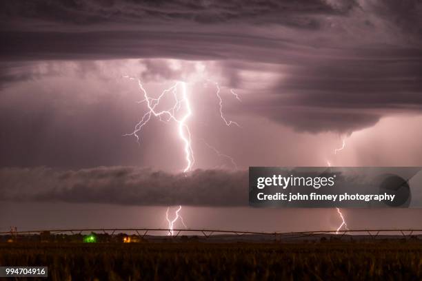 lightning and storm cloud structure, nebraska. usa - forked lightning stock pictures, royalty-free photos & images