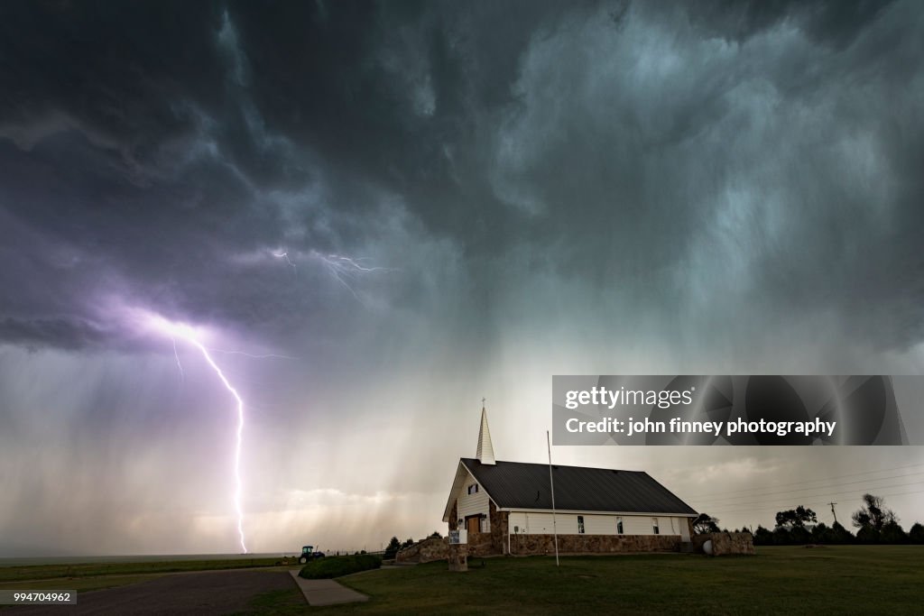 Lightning and Chapel of the Plains, Colorado. USA