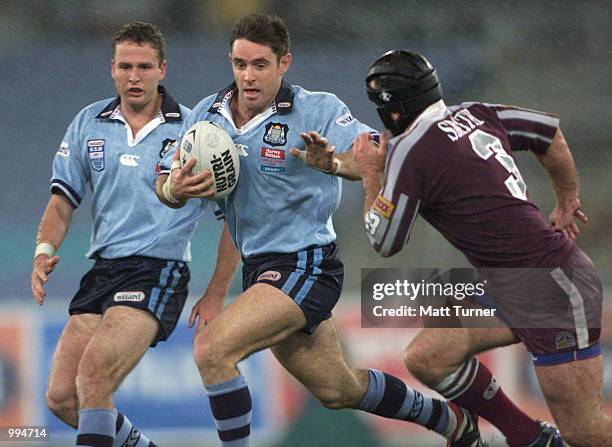 Darren Smith of QLD Maroons chases captain Brad Fittler of the NSW Blues during the second State of Origin match played at Stadium Australia, Sydney...