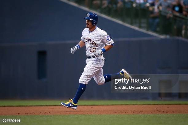 Tyler Saladino of the Milwaukee Brewers rounds the bases after hitting a home run in the third inning against the Atlanta Braves at Miller Park on...