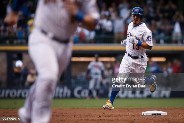 Tyler Saladino of the Milwaukee Brewers rounds the bases after hitting a home run in the third inning against the Atlanta Braves at Miller Park on...