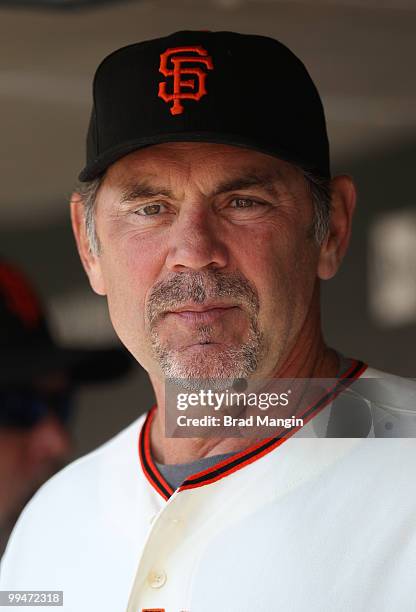 Manager Bruce Bochy of the San Francisco Giants watches from the dugout during the game between the San Diego Padres and the San Francisco Giants on...