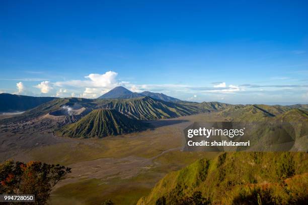 beautiful view landscape of active volcano crater with smoke at mt. bromo, east java, indonesia. - bromo tengger semeru national park stockfoto's en -beelden