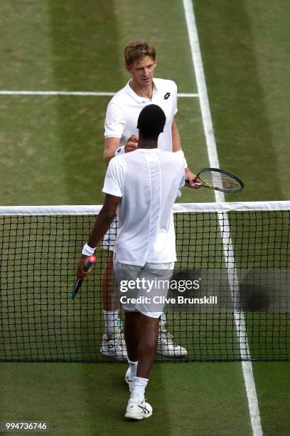 Kevin Anderson of South Africa is congratulated by Gael Monfils of France during their Men's Singles fourth round match on day seven of the Wimbledon...