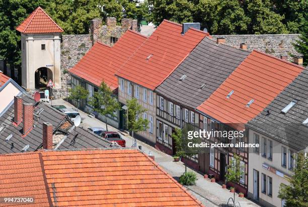 June 2018, Germany, Templin: View from the tower of the St Mary Magdalene Church in Templin onto buildings in the city centre. The city councillors...