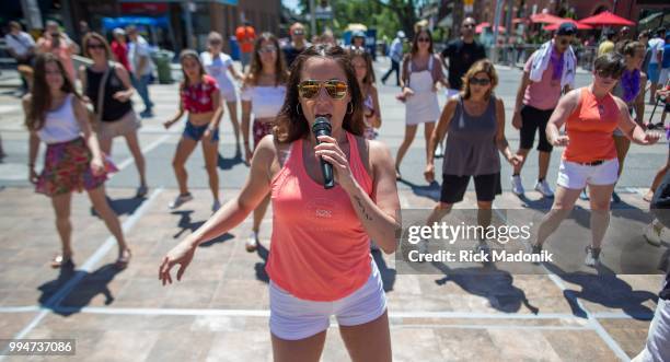 Breanne MacGrath, of Soul2Soul Latin Dance, talks participants through some of the basic moves during Salsa on St. Clair festival. Summer fun in the...