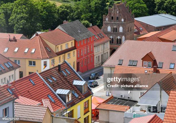 June 2018, Germany, Templin: View from the tower of the St Mary Magdalene Church in Templin onto buildings in the city centre. The city councillors...