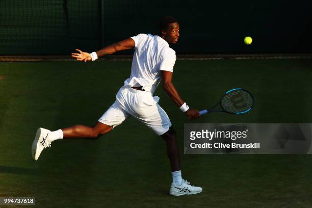 Gael Monfils of France plays a backhand against Kevin Anderson of South Africa during their Men's Singles fourth round match on day seven of the...