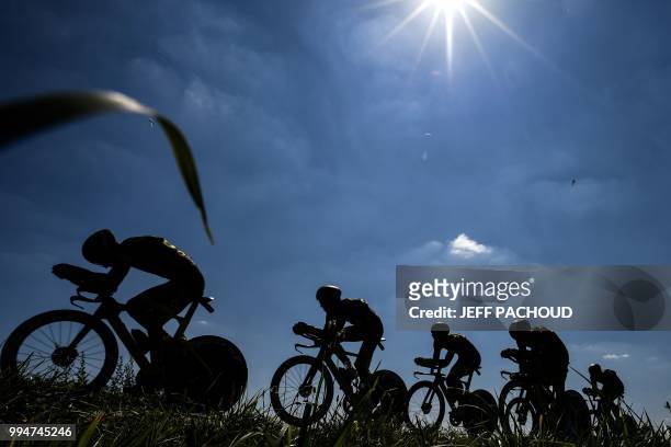 Riders of France's Direct Energie cycling team pedal during the third stage of the 105th edition of the Tour de France cycling race, a 35.5 km team...