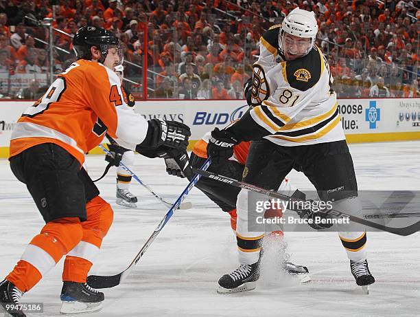 Miroslav Satan of the Boston Bruins takes the shot past Danny Briere of the Philadelphia Flyers in Game Six of the Eastern Conference Semifinals...