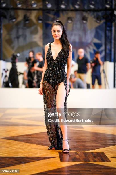 Deborah Hung wears a black lace mesh dress and attends the Ulyana Sergeenko Haute Couture Fall Winter 2018/2019 show as part of Paris Fashion Week on...