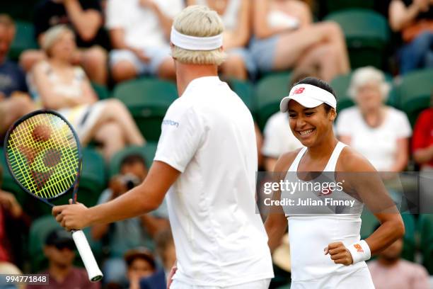 Henri Kontinen of Finland and Heather Watson of Great Britain celebrate a point during their Mixed Doubles second round match against Marcin...