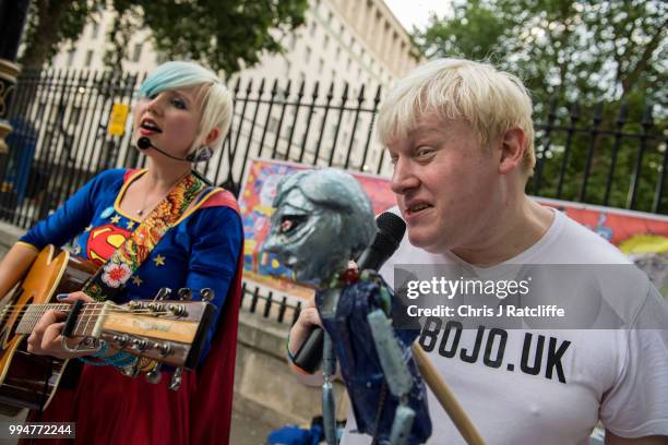 Boris Johnson impersonator sings protest songs opposite Downing Street on July 9, 2018 in London, England. Boris Johnson resigned earlier today as...