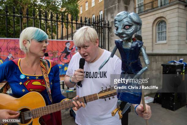 Boris Johnson impersonator sings protest songs opposite Downing Street on July 9, 2018 in London, England. Boris Johnson resigned earlier today as...