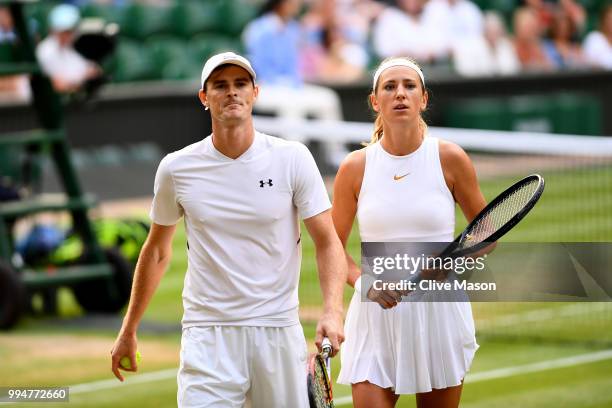 Jamie Murray of Great Britain and Victoria Azarenka of Belarus during their Mixed Doubles second round match against Robert Farah of Colombia and...