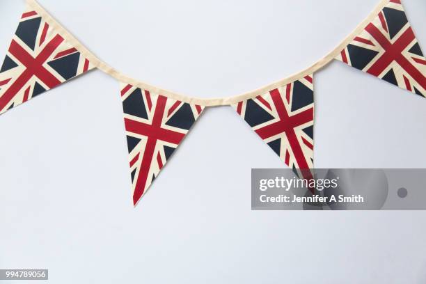 union jack bunting - british culture stock pictures, royalty-free photos & images